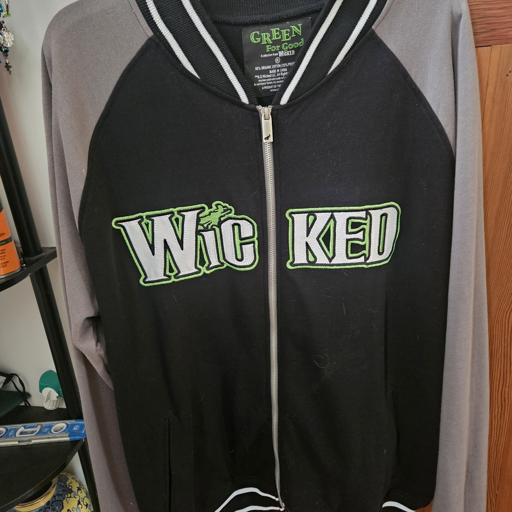 Officially licensed "Wicked: The Musical" Green for Good varsity jacket